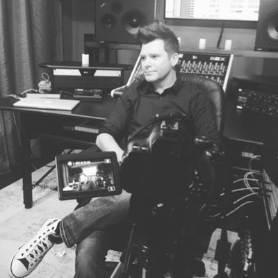Photo of Aaron Pearce in a recording studio