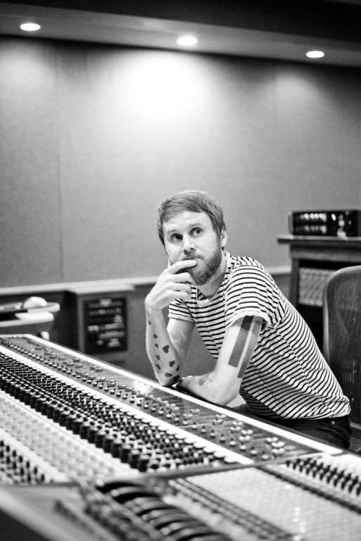 Photo of Ben Lovett in a recording studio.